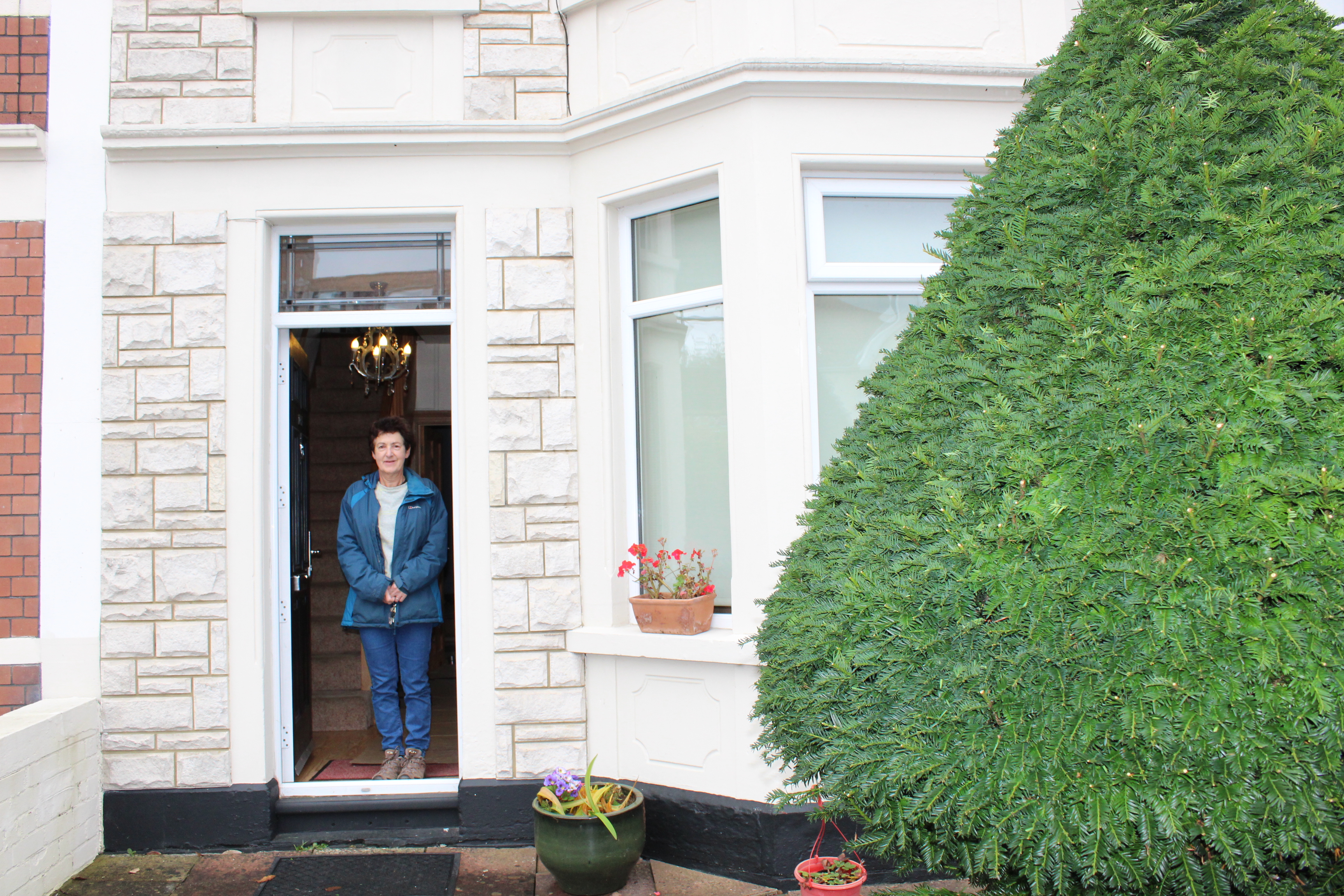 KJ at the front door with Christmas tree